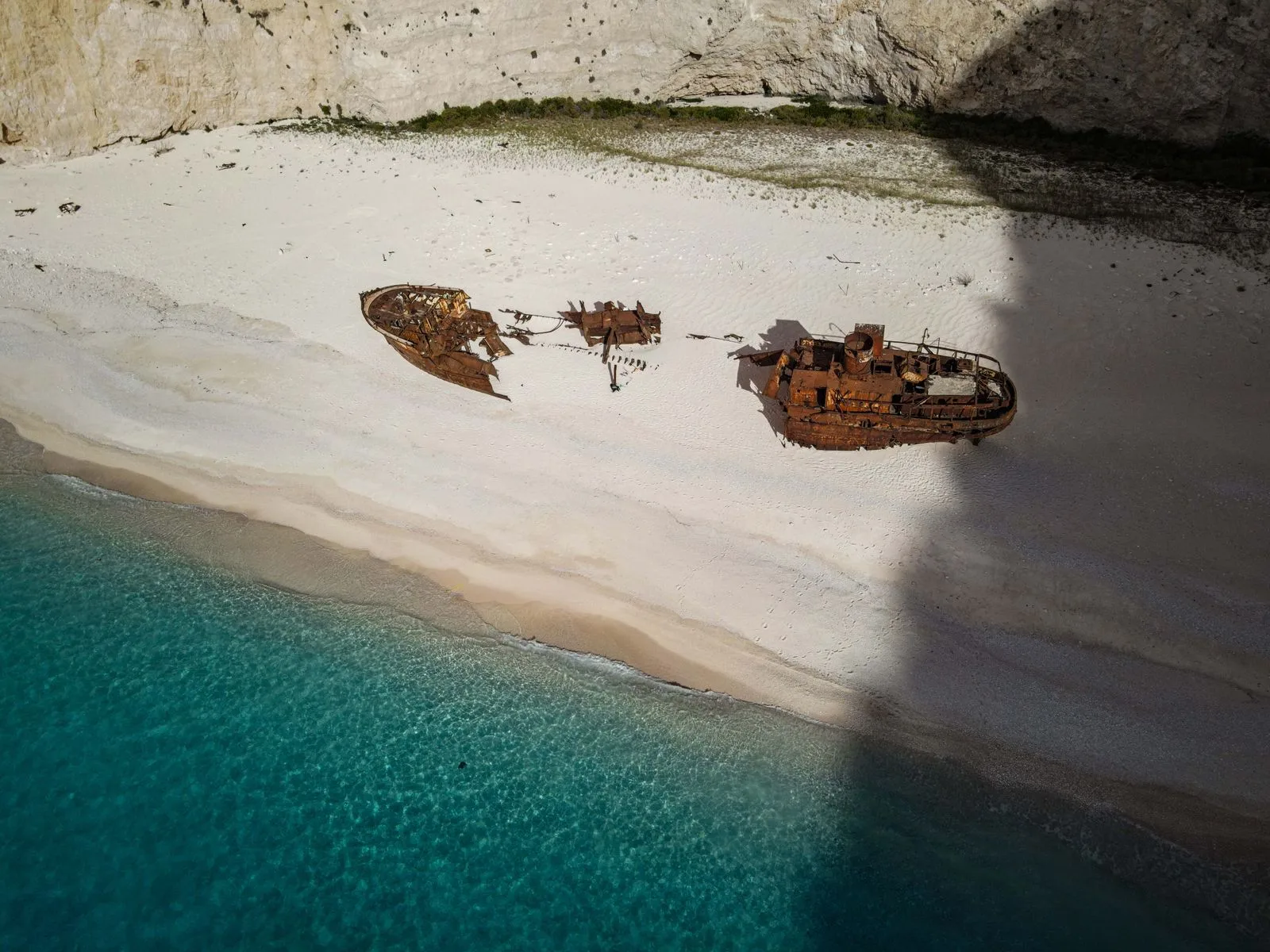 The rusted shipwreck on Navagio Beach, Zakynthos, with turquoise water and dramatic cliffs