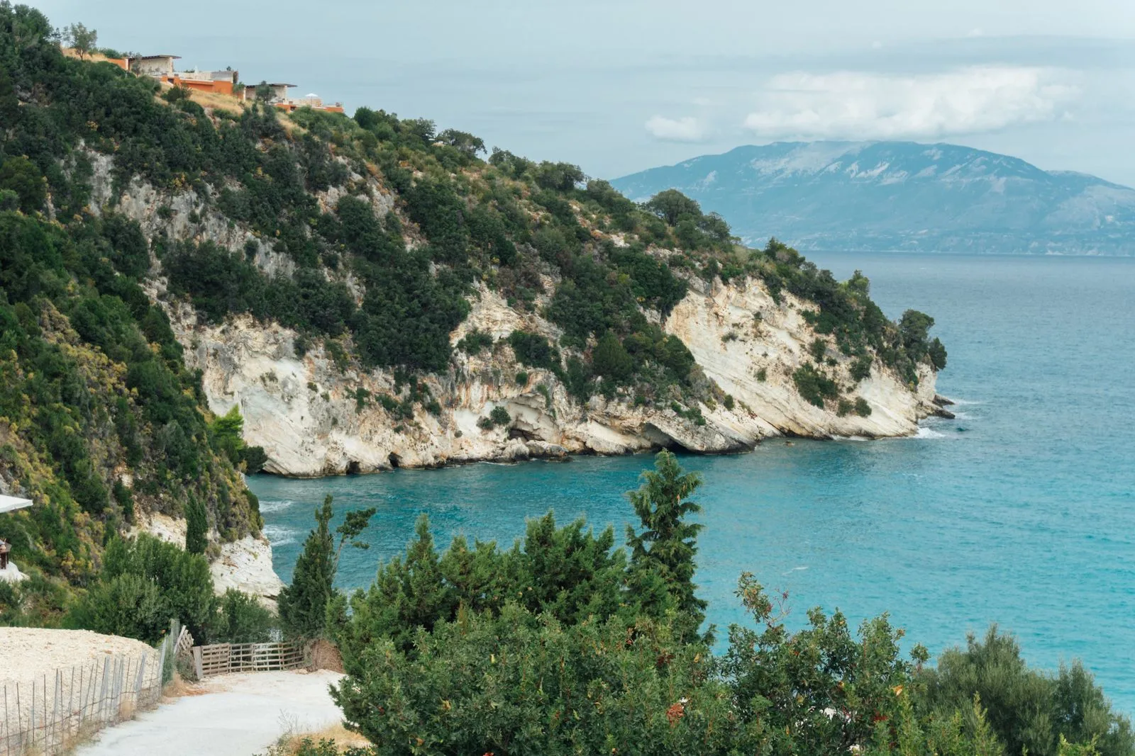 Cliffside view of turquoise waters along the Zakynthos coastline, similar to the viewpoint above Xigia Beach