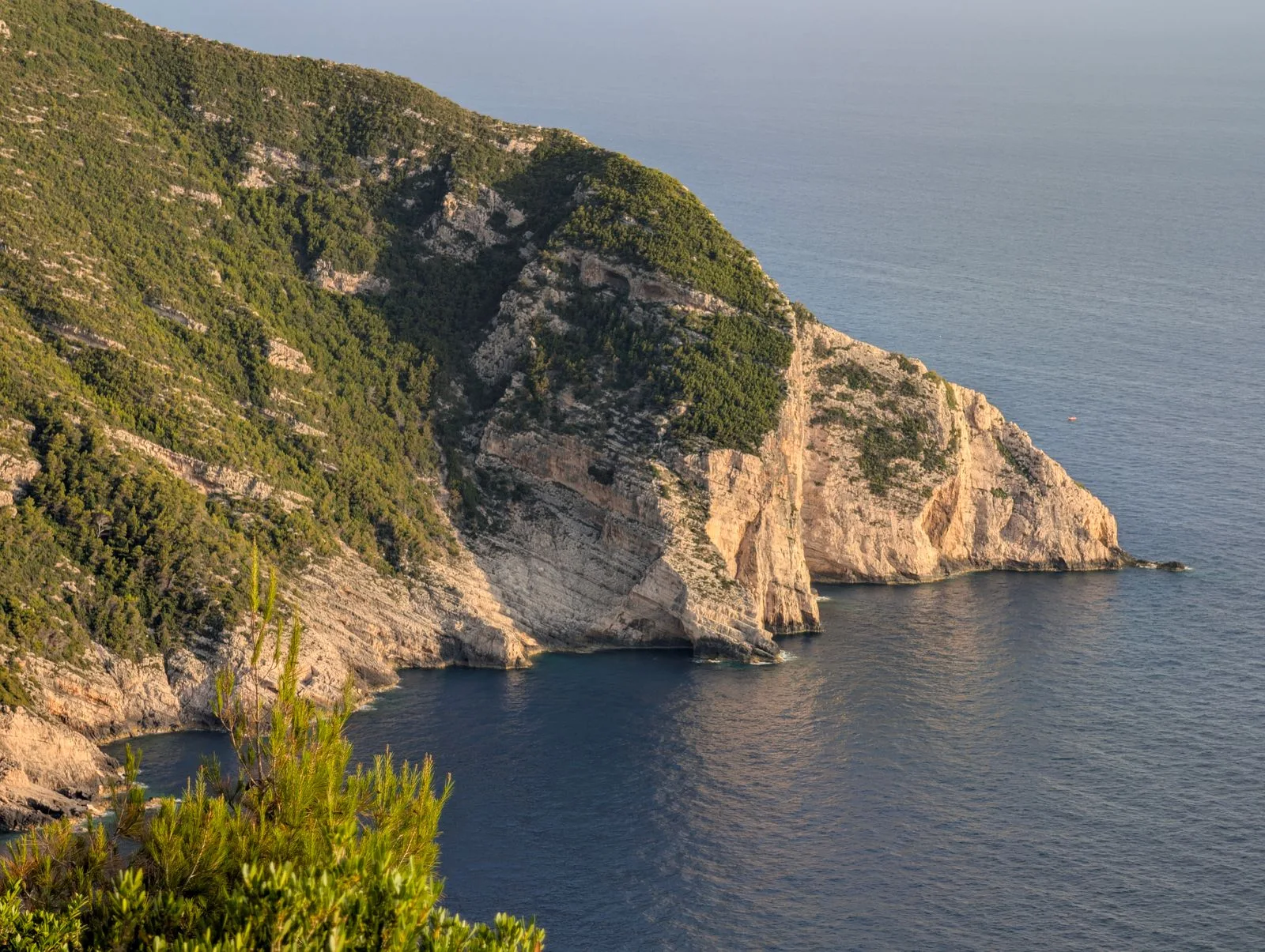 Golden sunset over cliffs and sea near Keri, Zakynthos, similar to the Mizithres viewpoint at dusk